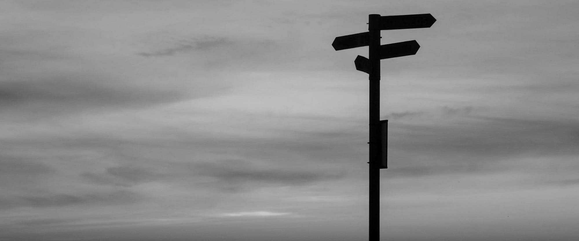 silhouette of road signage during golden hour