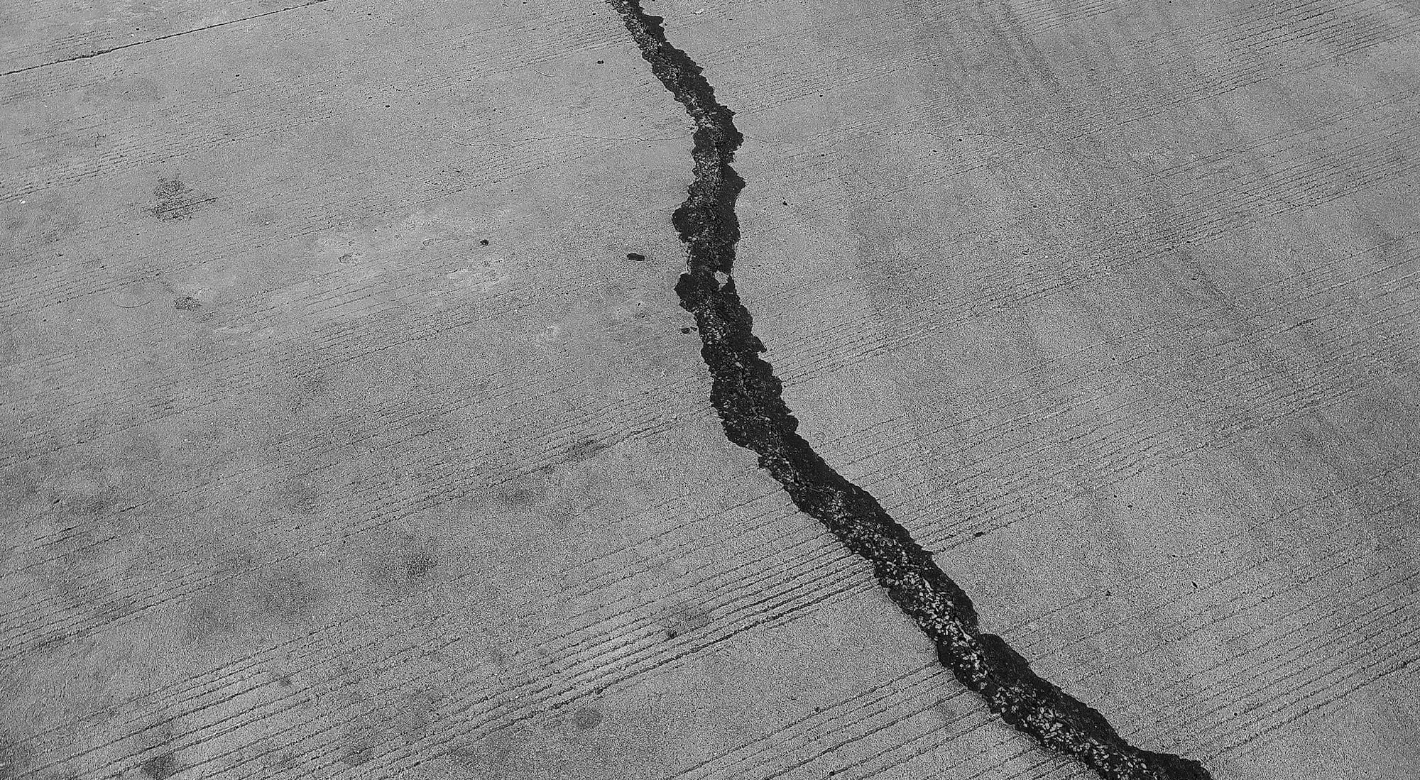 grayscale photo of a wooden floor